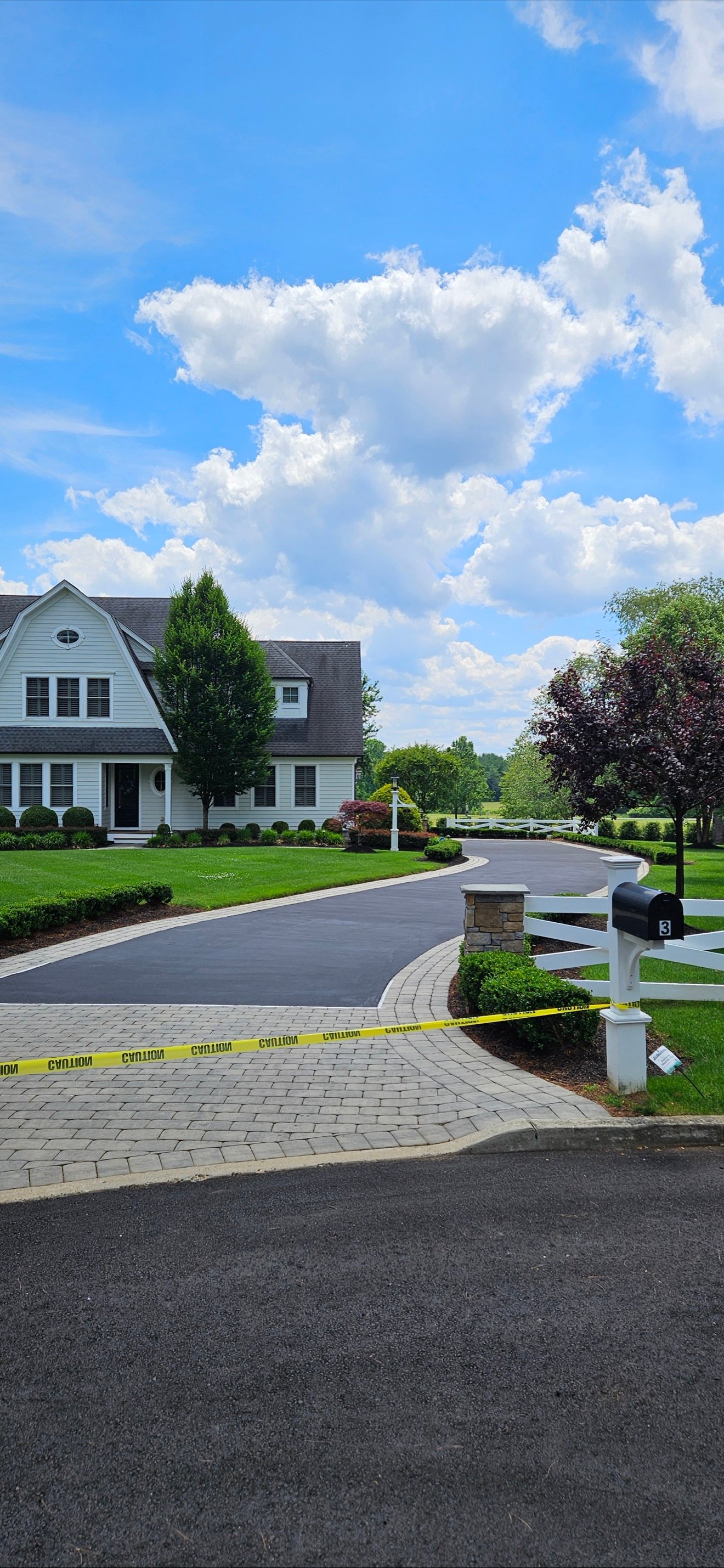 Freshly sealcoated average-size residential driveway